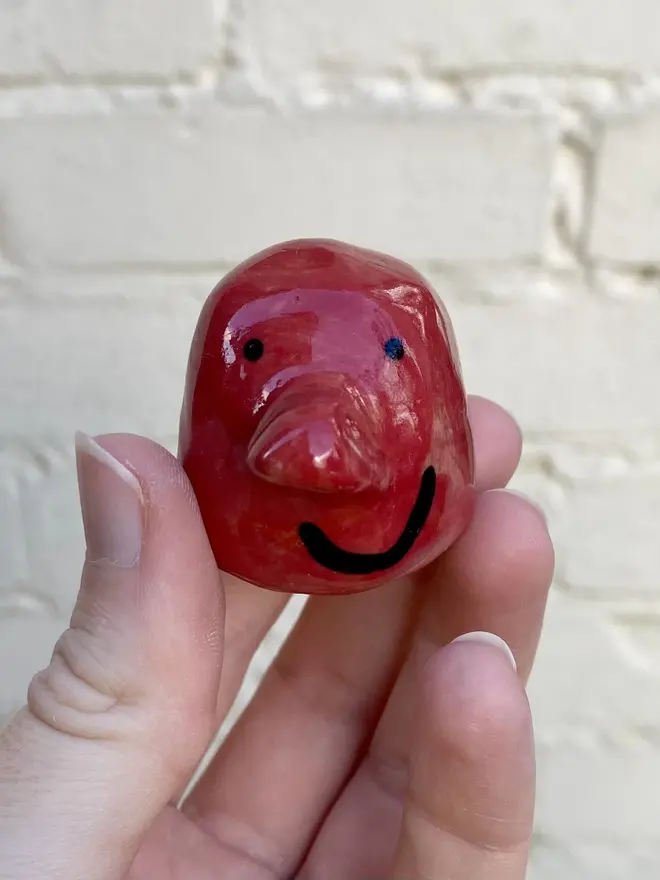 red handmade ceramic buddy ornament