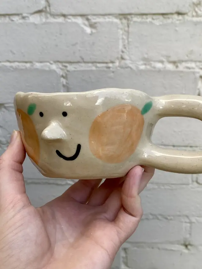 orange clementine handmade ceramic smiley face mug