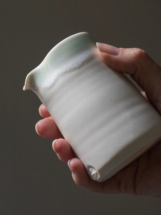 white handleless porcelain jug