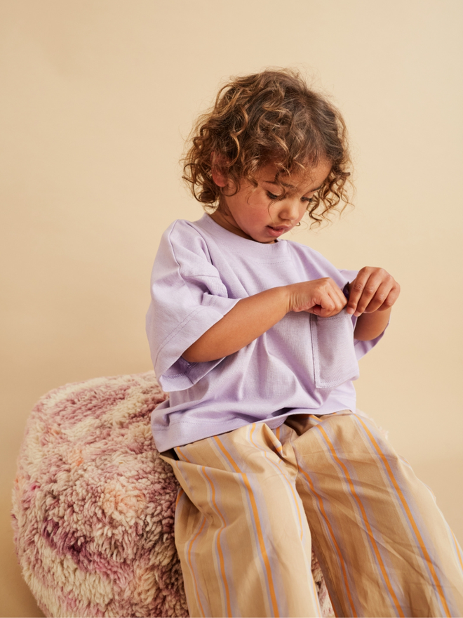 model wearing cool studio koter wide leg light summer kids and baby toddler trousers photographed by leonie freeman