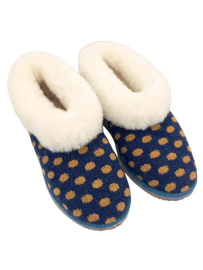 Women's Lambswool & Sheepskin Boot Slippers, a pair of boot slippers sitting on a plain white floor. 
