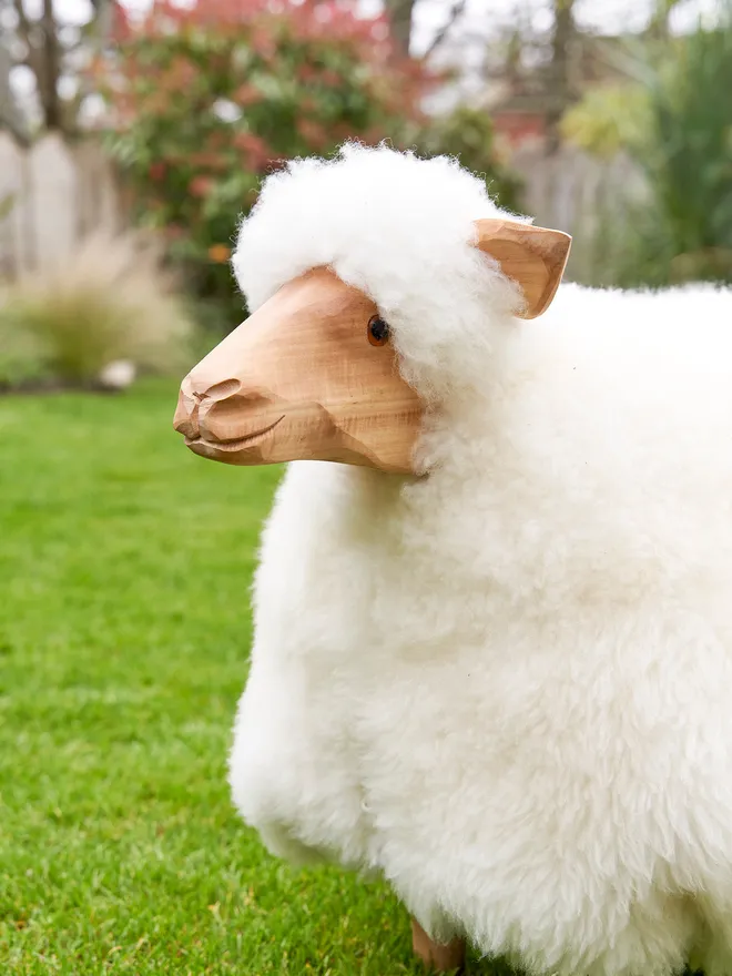 'Edith' Large sheep footstool in the garden for spring 