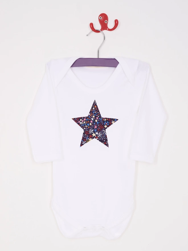 a liberty starry print star white bodysuit