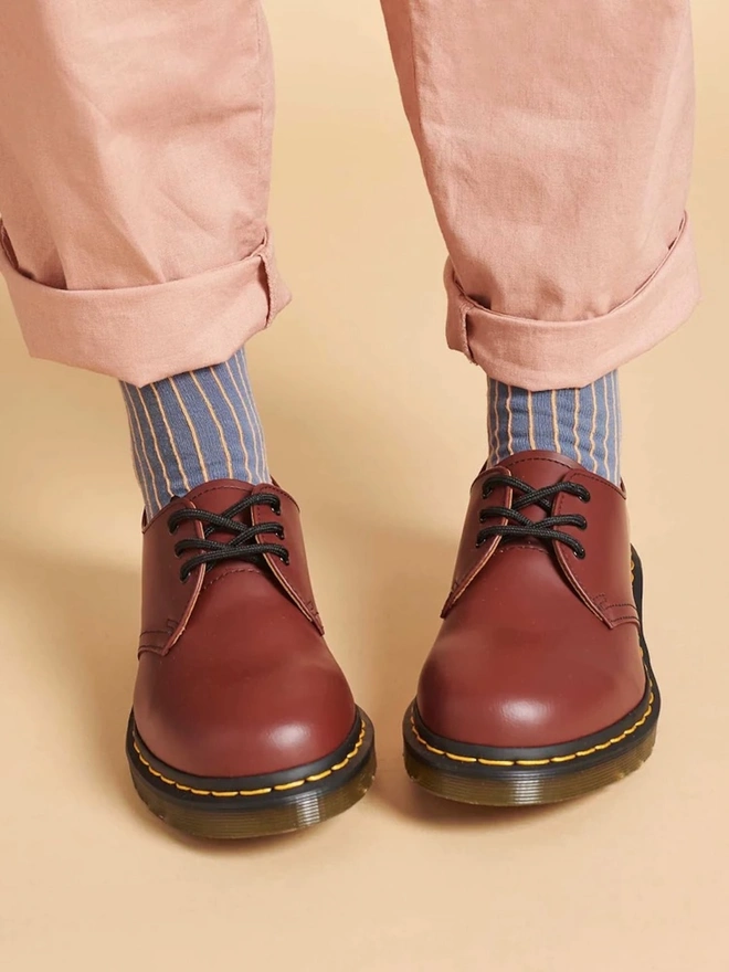 Women's Organic Cotton Ankle Socks Packs (Sets Of 3), a person wearing a pair of colourful patterned socks. 