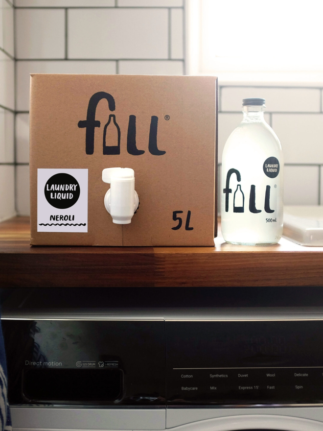 Laundry Liquid. A 5L refill box and a 500ml bottle next to each other on a counter.