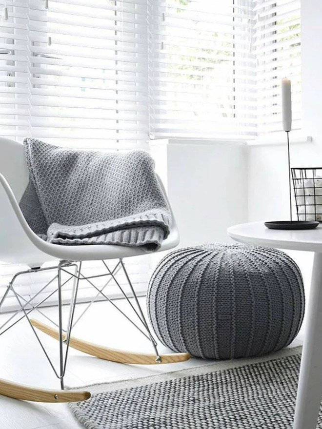 Zuri House. Large dark grey knitted pouffe.