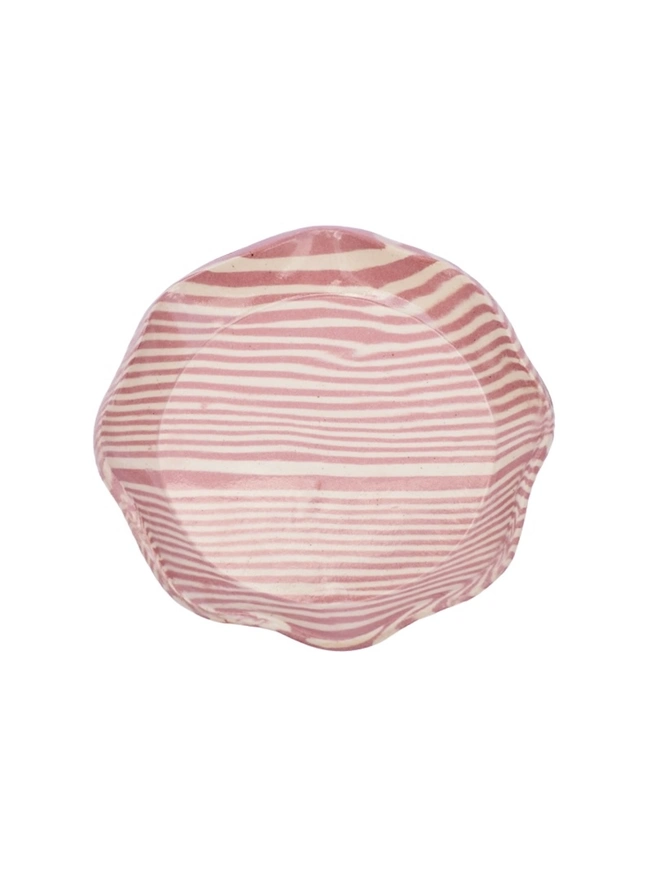 Striped Trinket Dish, a colourful trinket dish sitting on a white surface against a plain backdrop.