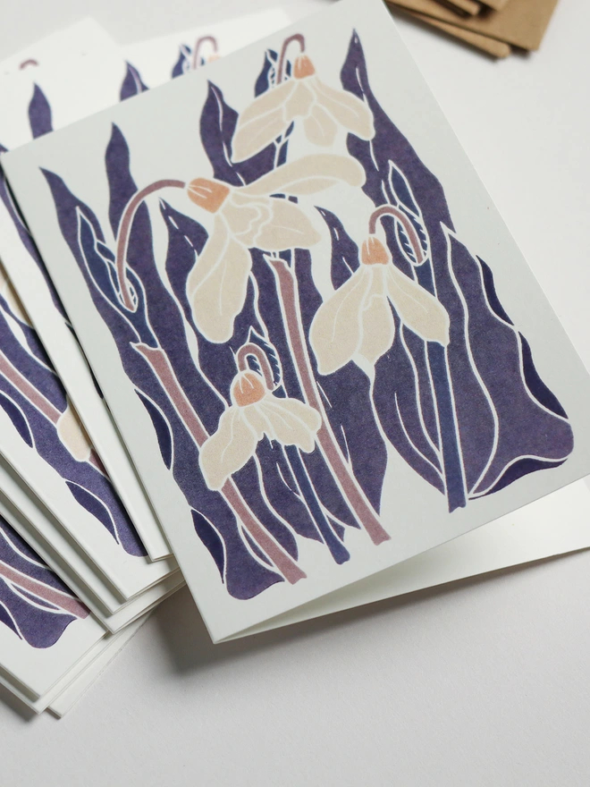 Snowdrop notecard set with recycled kraft envelopes. Eight A6 hand-carved botanical greeting cards and matching envelopes, eco-friendly stationery perfect for thank you notes and correspondence. British flora design.