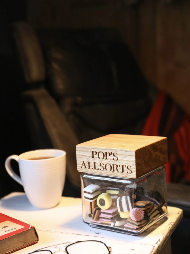 A jar of allsorts with Pop's name on it
