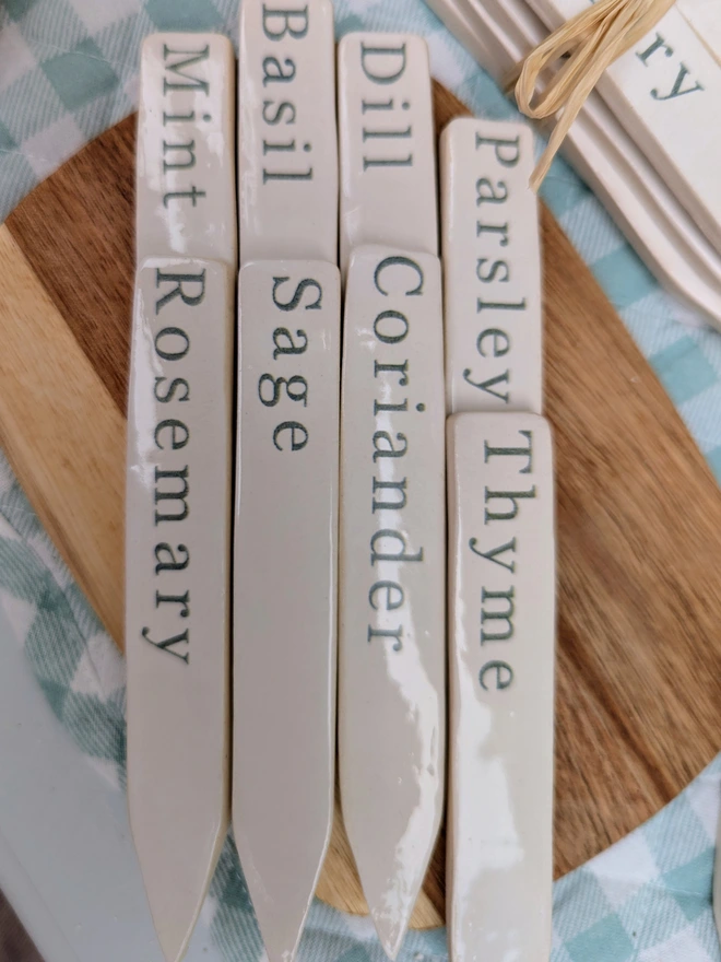 green ceramic herb labels