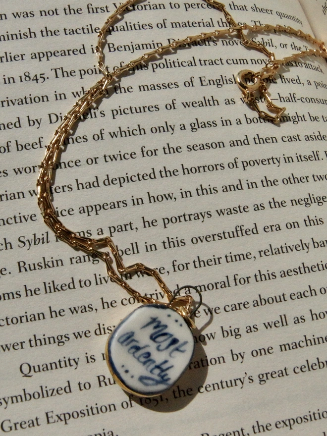 most ardently porcelain necklace on gold chain. pride and prejudice