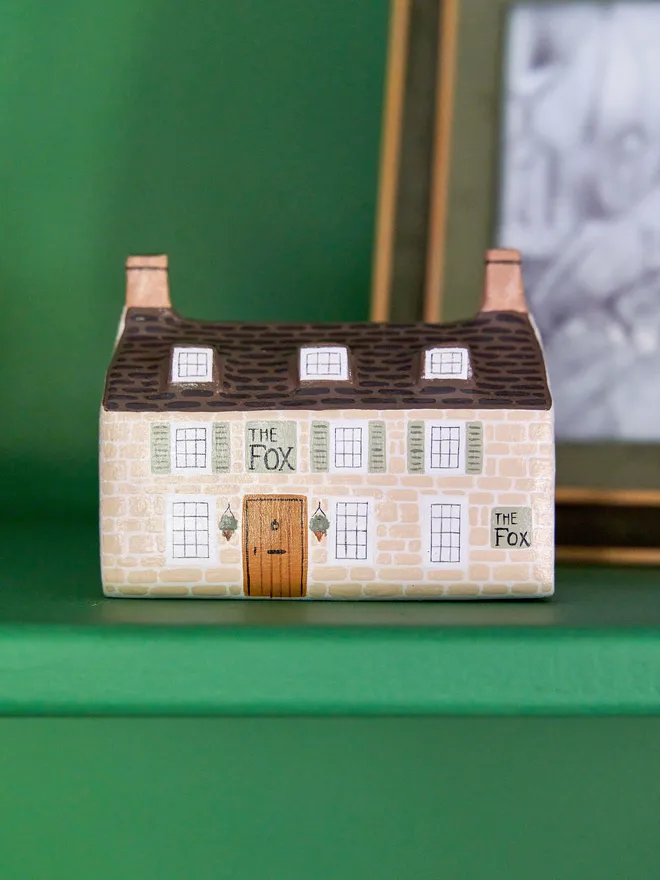 handmade ceramic sculpture in design of a pub