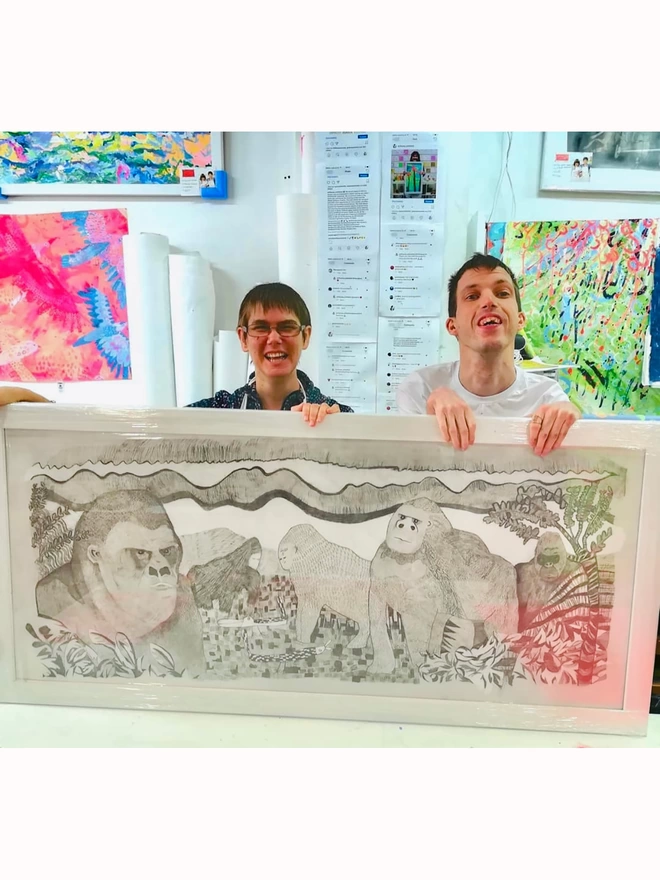 2 artists holding original pencil drawn artwork for gorillas sustainable insulated charity water bottle