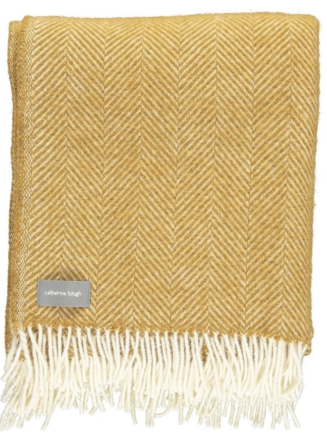Organic Wool Throw, an organic wool throw folded on a white surface. 