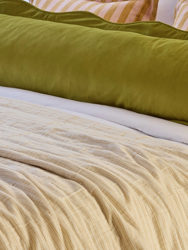 Kika Bespoke scalloped velvet cushion detail in olive. 