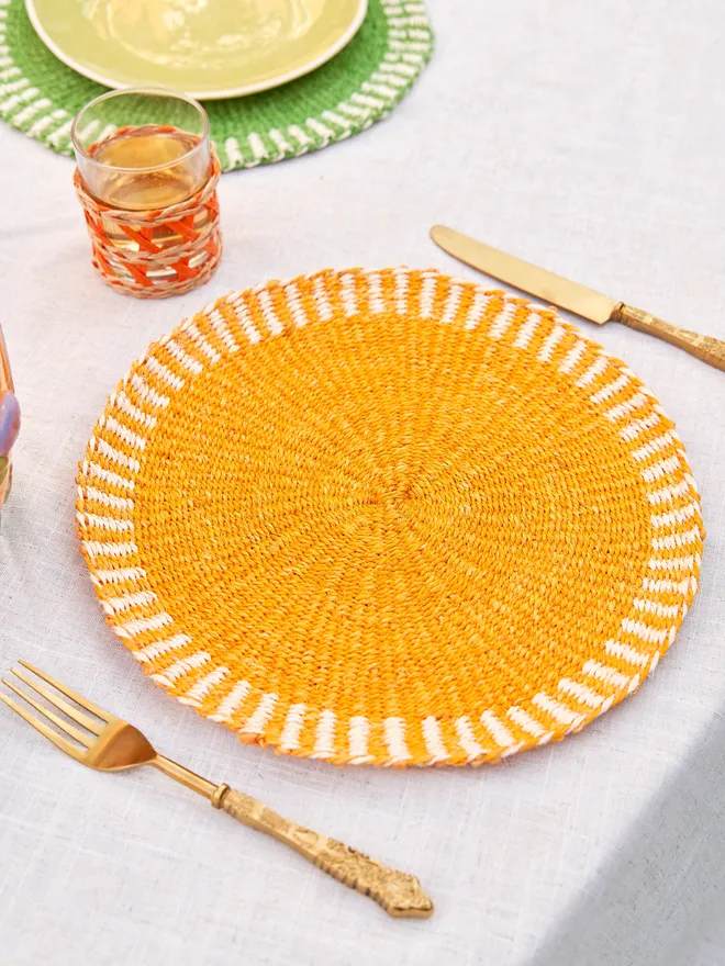 Hand woven orange placemat