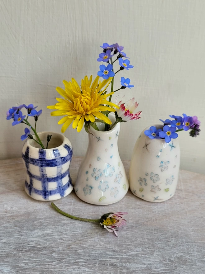3 mini vase ceramic pots with blue check and forget me not flower hand painted and daisies, forget me nots and dandelion flowers in  
