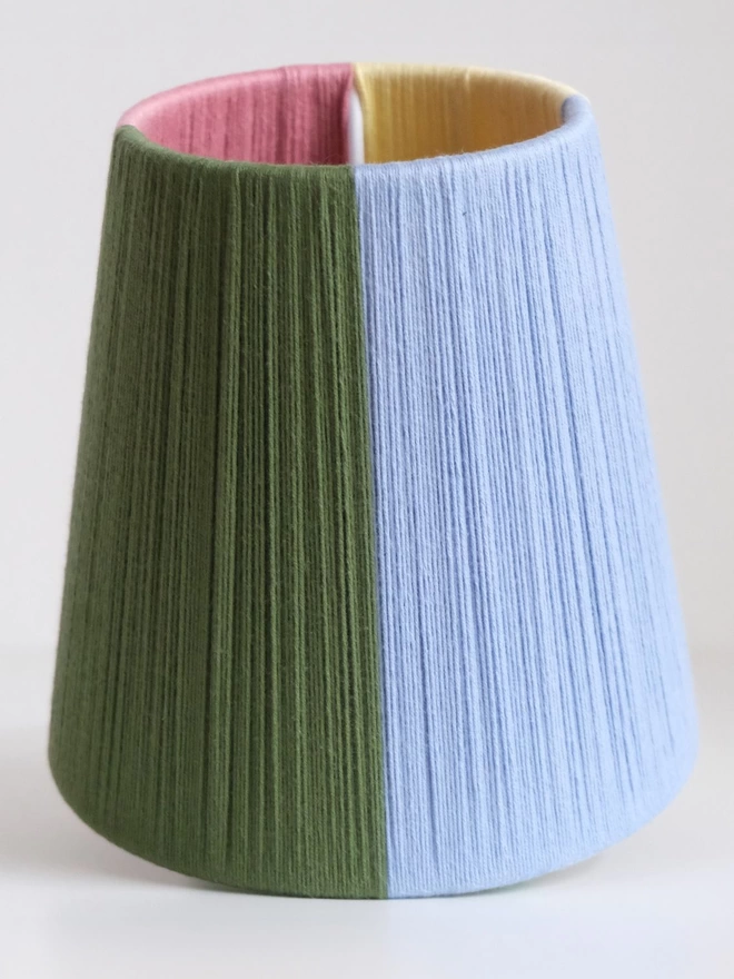 Quarter colourblock lampshade upright showing green and blue sections