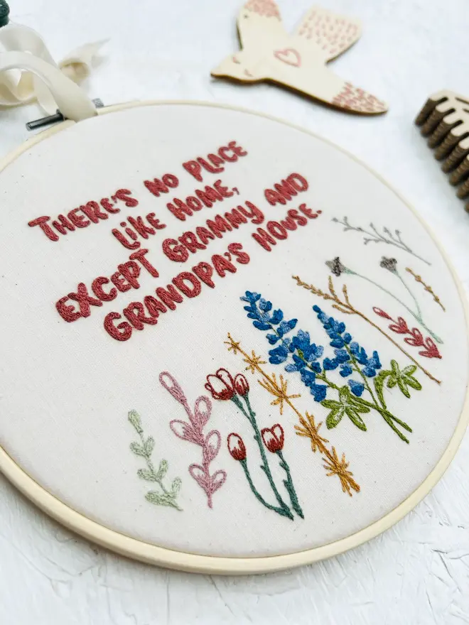 custom embroidered hoop. cotton hoop embroidered with multi coloured lettering.