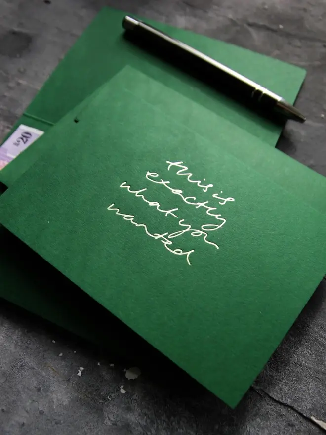 Hand foiled cash card or money wallet in a forest green colour handfoiled in shiny lime green text which says 'this is exactly what you wanted'.