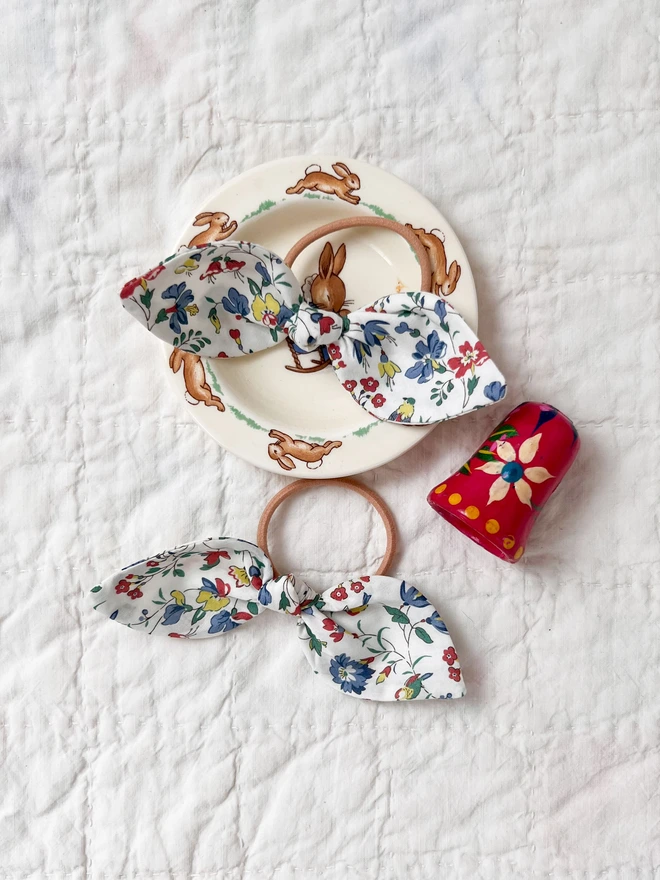 hair bobbles on a vintage plate