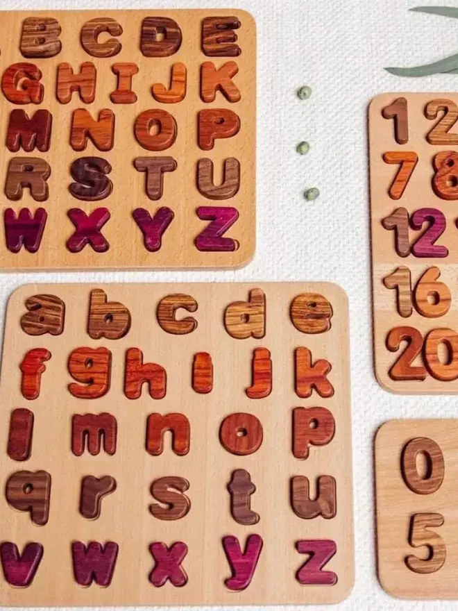 Wooden Uppercase Alphabet Puzzle Heirloom Toy, on a table. 