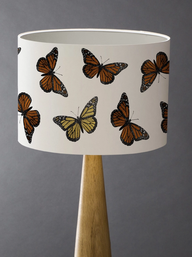 Mountain & Molehill monarch butterfly shade with gold detail on wood lamp base