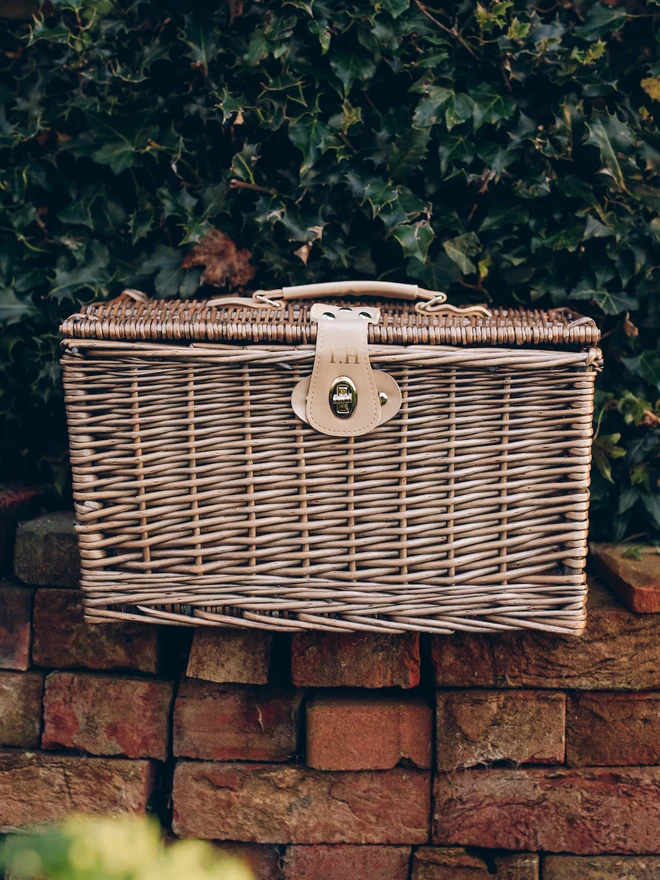 monogrammed wicker hamper basket on wall