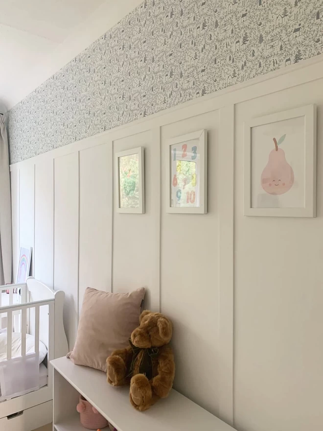 Cottages in the woods dusk blue wallpaper in girls nursery with white wall panelling