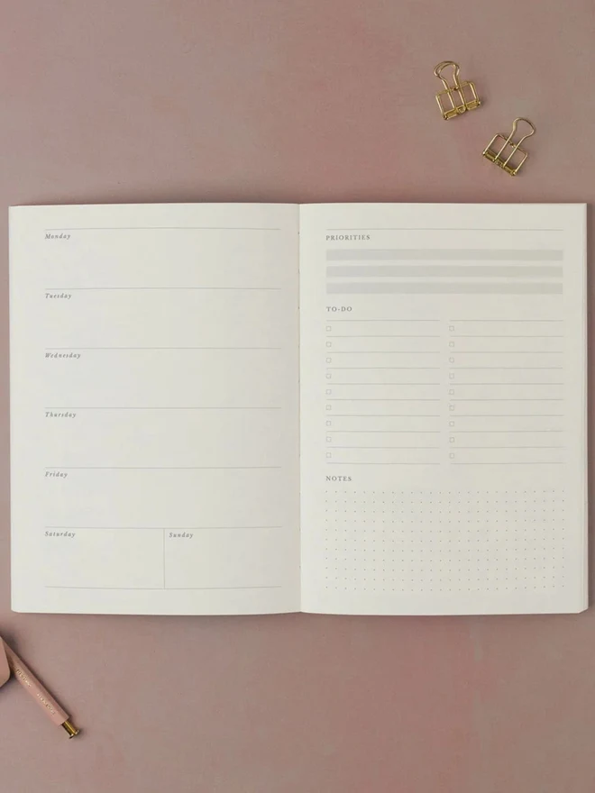 Pinstripe Weekly Planner open to a weekly planning spread