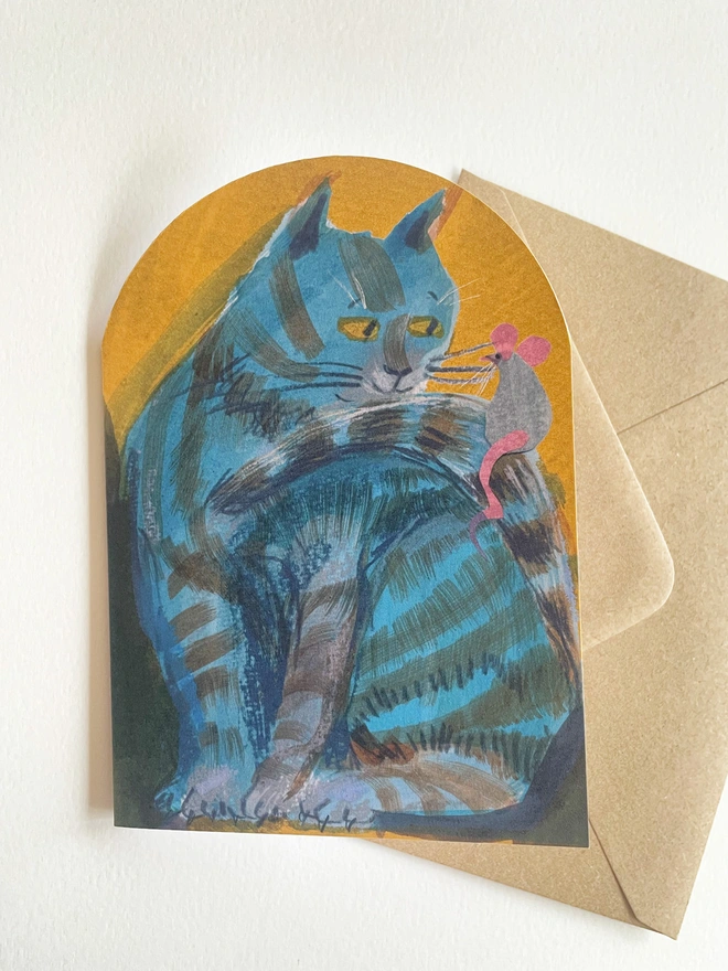 Esther Kent illustrated arch-shaped greeting card showing a blue striped cat looking at a mouse perched on its tail.