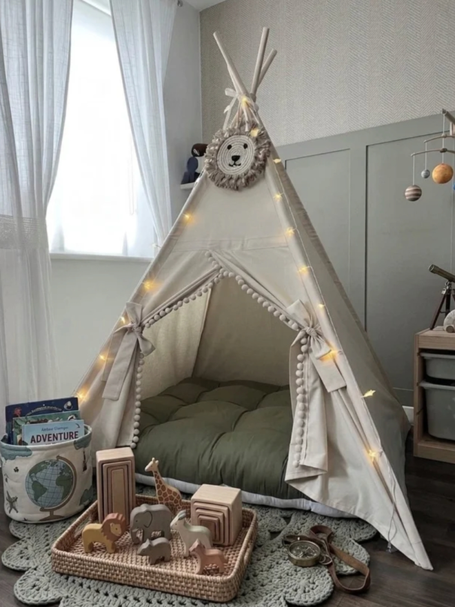 Personalised Natural and Olive Teepee. A tent outside for a children’s party.