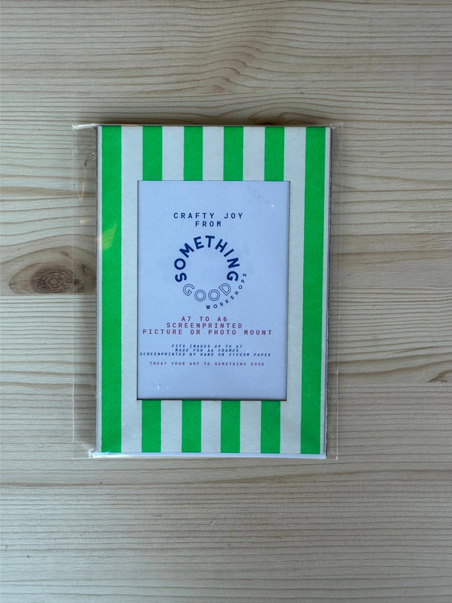 Thin Striped Screen Printed A6 / A5 / A4 Photo Mount. green striped mount pictured on a wooden table.