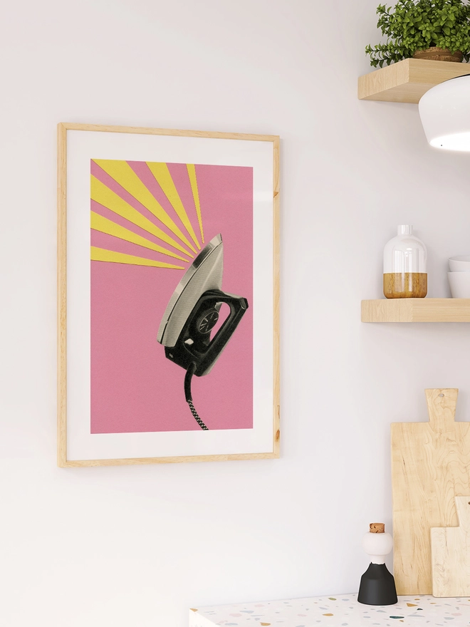  A print depicting a vintage iron against a pink background,