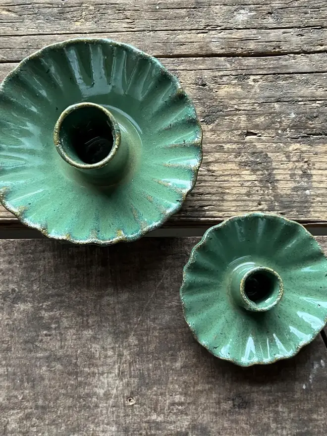 Handmade Green Ceramic Candlestick Holder, a pair of green candlestick holders sitting on a wooden surface. 