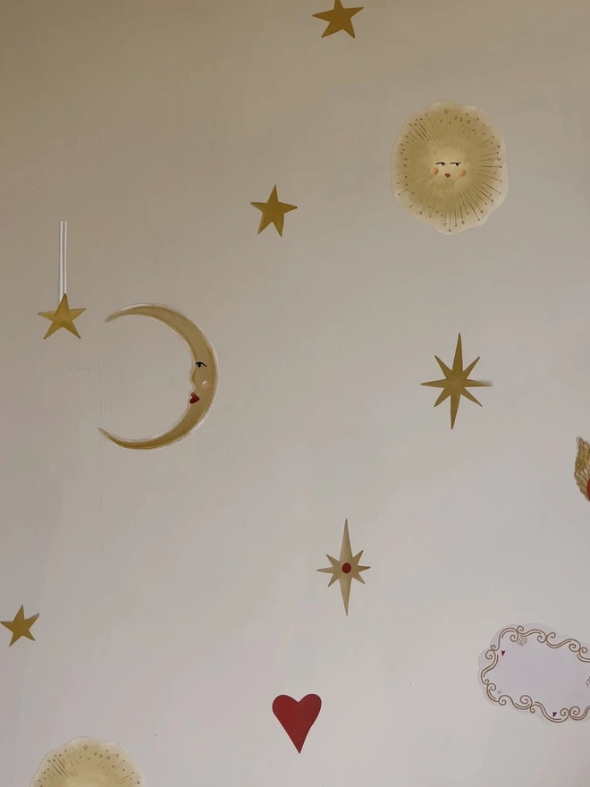 Celestial Dream Fabric Wall Stickers, a wall decorated with colourful wall stickers. 