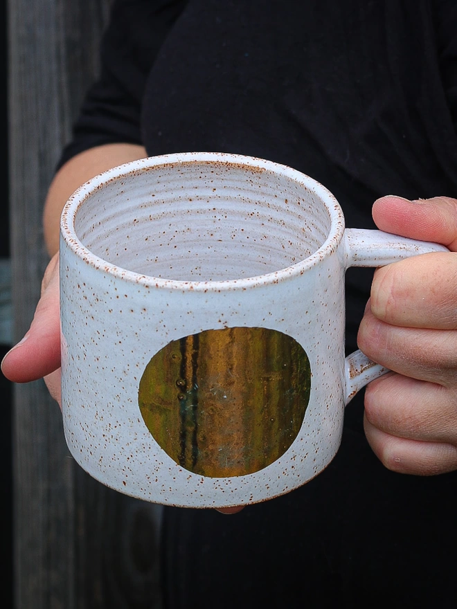 white mug with gold spot 