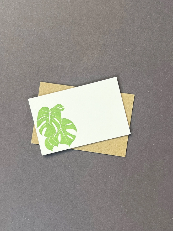 Single letterpress green monstera leaf tiny note card and kraft envelope