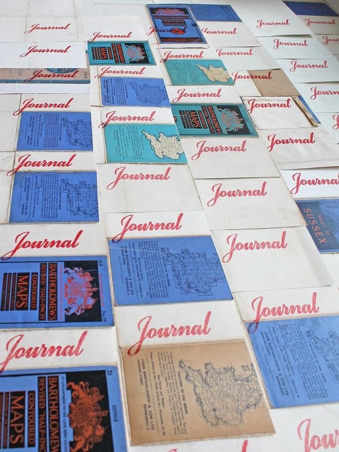 red script journal covers laid out to dry