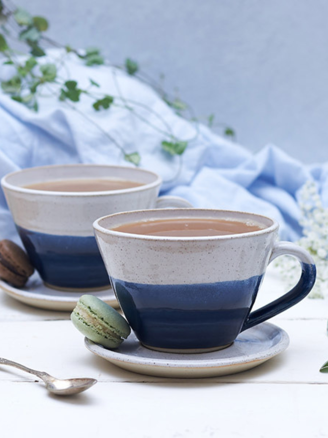 blue and white ceramic mug and saucer