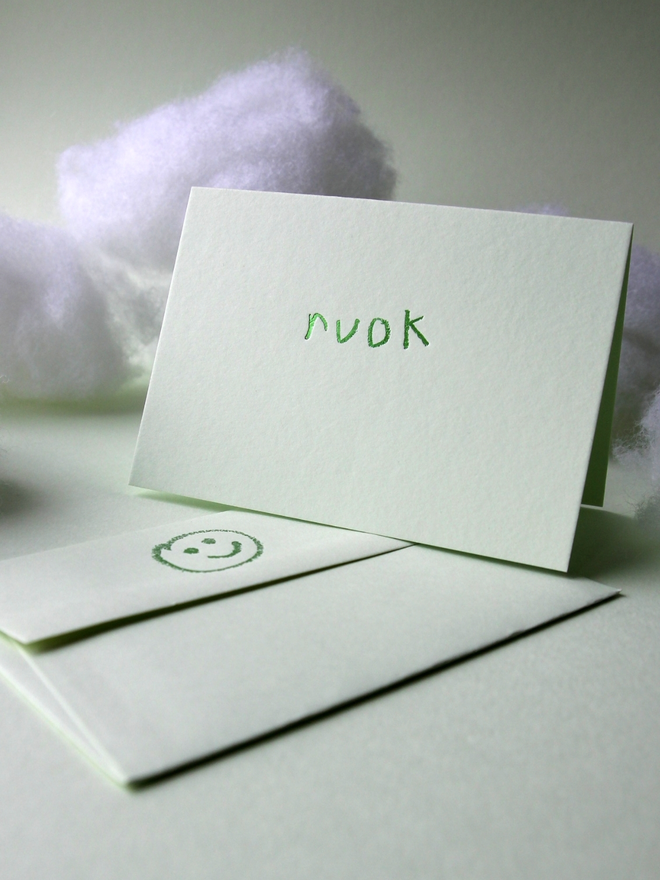 pistachio coloured card with ruok short for 'are you ok' hand foiled in kids hand writing