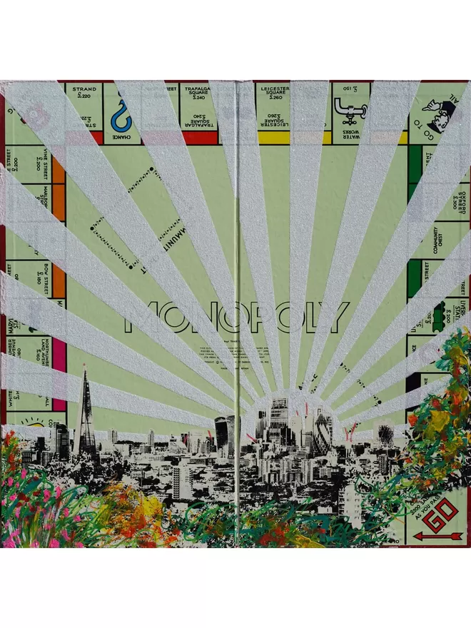 Monopoly Board with views of London skyline printed on top and silver glitter stripes