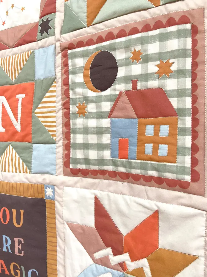 personalised baby quilted wall hanging. a patchwork hanging quilt decoration to commemorate a baby's birth.