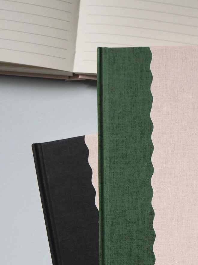 two notebooks with with a scallop detail 