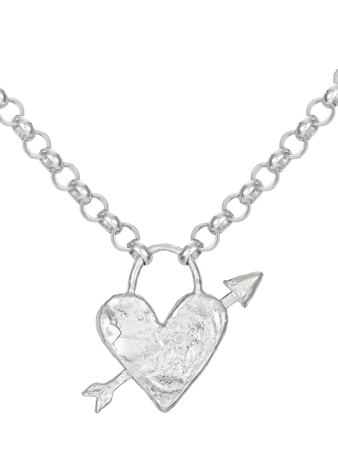 Medium heart arrow necklace. A silver heart with an arrow through it 