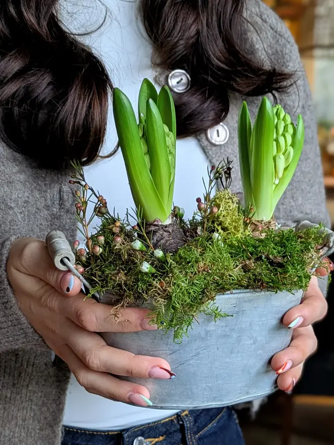 A Woman Holding A Spring Bulbs Oval Zinc Planter With Handles