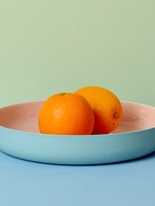 Serving Plate. A turquoise serving plate with pink interior.