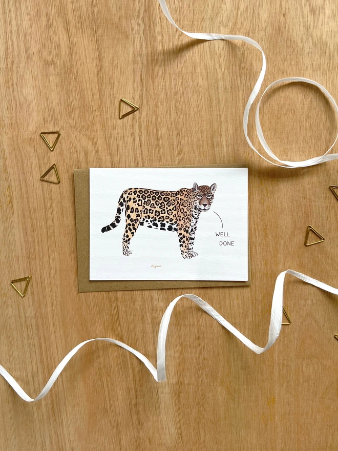  a greetings card featuring an illustration of a jaguar with the text “well done”