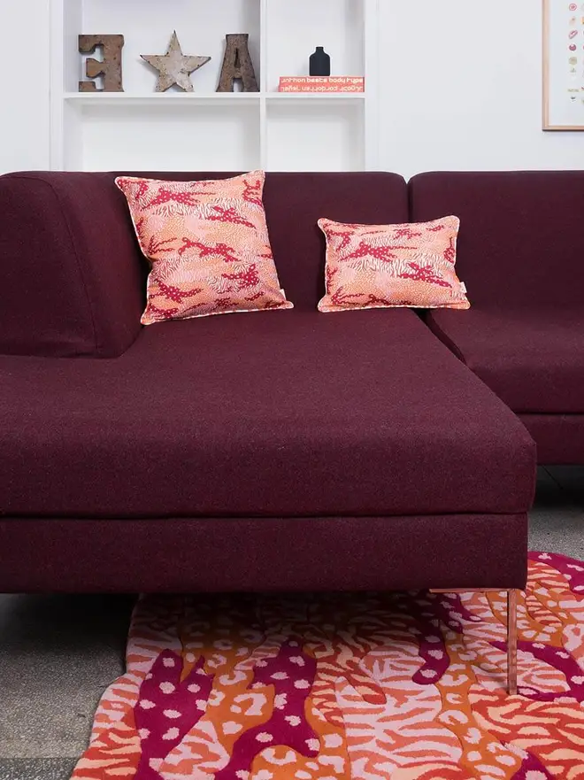 Big Cat Camo Hand Tufted Rug, a colourful rug sitting in a living room. 