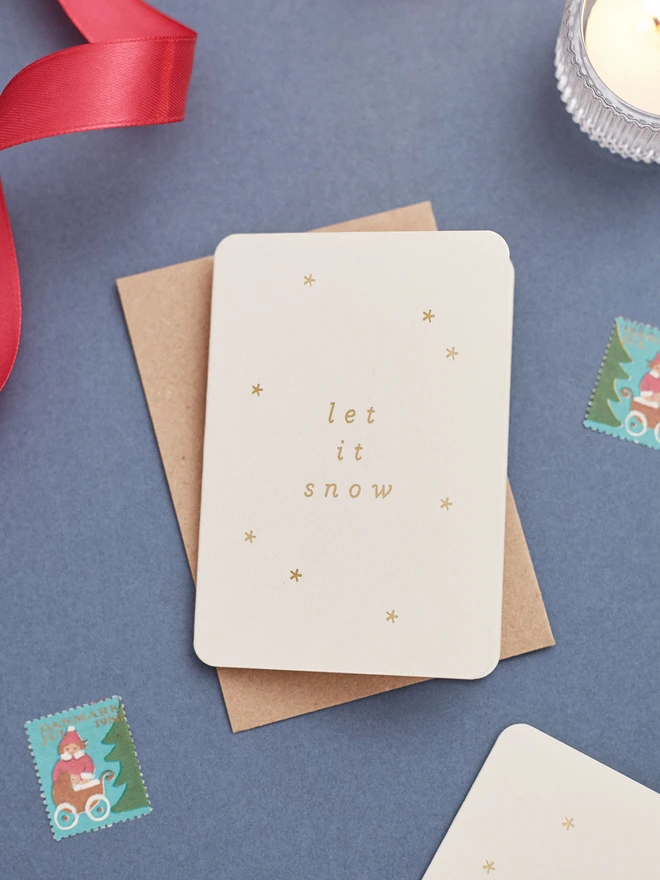 minimal-christmas-card-with-let-it-snow-gold-foil-lifestyle CC-SNOW-GD.jpg